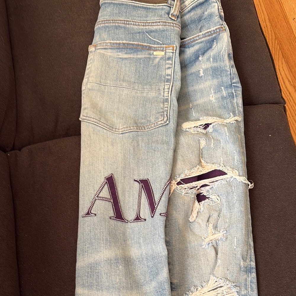 Distressed Light Blue Jeans With Patch - image 5